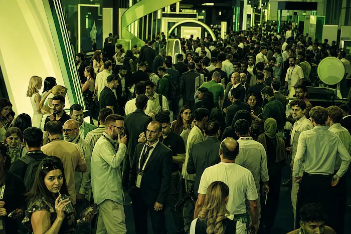 Forex Expo Dubai 2026 crowded exhibition hall with thousands of attendees networking at the event.